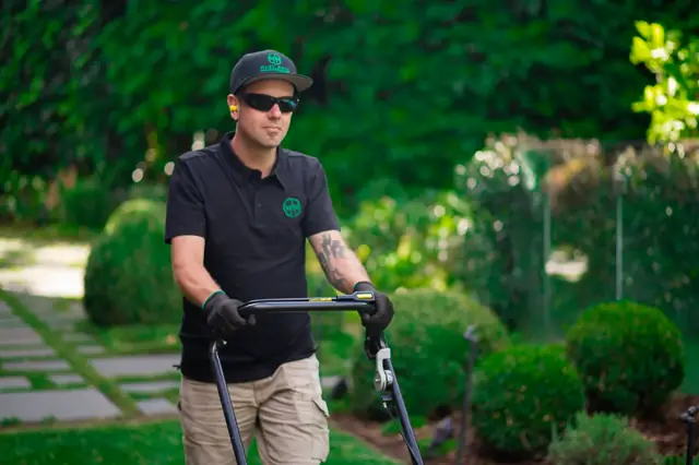 Lawn mowing and edging in progress